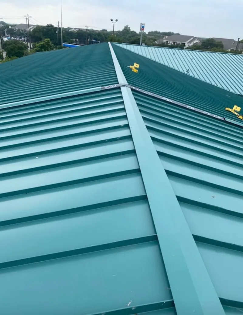 Green commercial metal roof ridge and valley for Metal Roof Repair in Kingsville