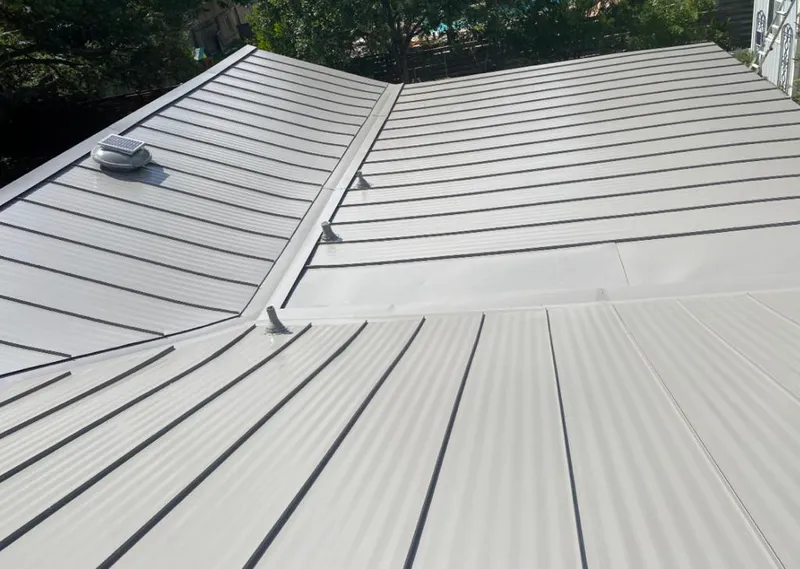 Solar attic fan installed on a metal roof for Roof Ventilation in Kingsville